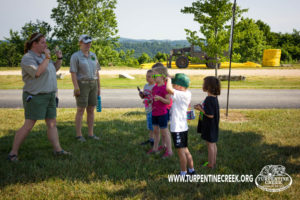 Education team members and kids at day camp